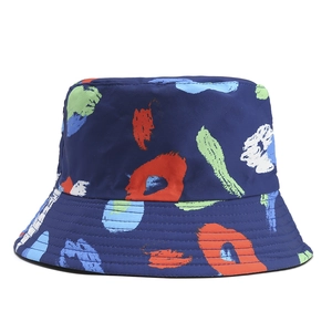 Close-up of dark blue bucket hat with colorful graffiti abstract print and fine fabric detail