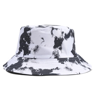 Detail of black and white tie-dye bucket hat showing reinforced stitching on cotton brim