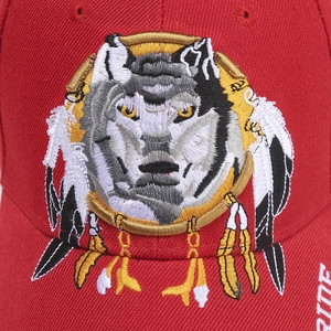 Close-up of high-density 3D wolf head embroidery on red cotton baseball cap