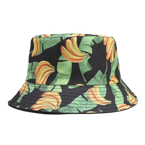 Detailed stitching and banana leaf pattern on a black reversible cotton bucket hat