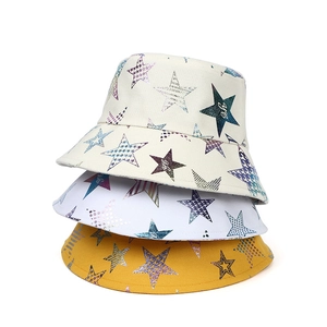 Canvas bucket hats with colorful star prints in cream, white, and yellow colors