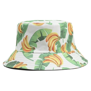 Detail of banana and leaf print on white cotton bucket hat with parallel stitching
