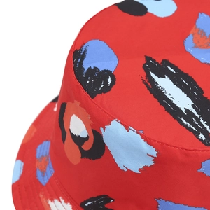 Red bucket hat featuring abstract colorful art print and durable cotton stitching detail