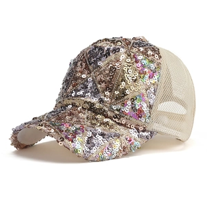 Detail of sequin baseball cap showing breathable mesh and sparkling geometric pattern