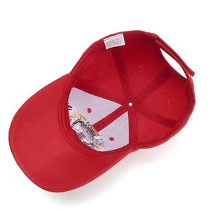 Red baseball cap with wolf embroidery and 100% acrylic material wash label details