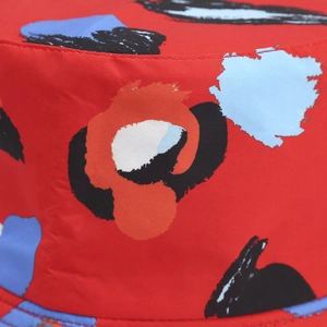 Streetwear red bucket hat with abstract hand-drawn print for outdoor travel sun protection