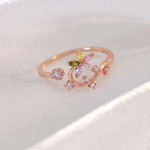 Detailed close-up of rose gold adjustable floral ring with colorful marquise zircons