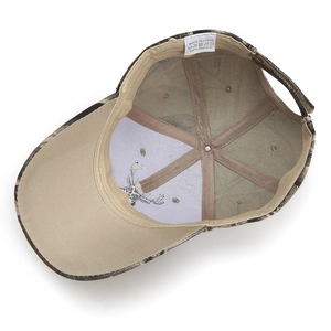 Inside view of camouflage baseball cap showing khaki sweatband and 100% acrylic label
