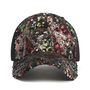 Detailed view of shimmering multi-color sequins and breathable mesh on a baseball cap