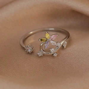 Detail of silver adjustable open ring with colorful zircon floral petal design