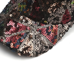Sparkly sequin baseball cap featuring a vibrant Union Jack flag design in red and blue