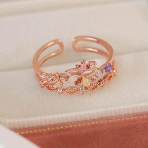 Macro view of rose gold double-layer open ring with multi-color zircon butterfly and floral
