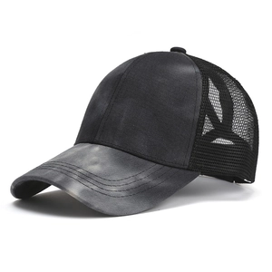 Detail of black tie-dye ponytail mesh baseball cap with gray gradient distressed brim