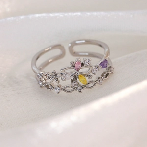 Close-up of adjustable silver ring with colorful zircon butterfly and floral design