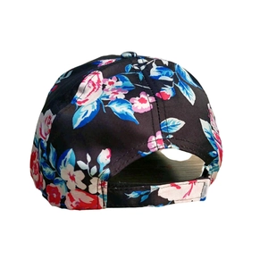 Black floral baseball hat with pink and blue flower prints shown from the back view