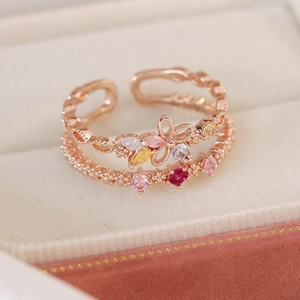 Detailed macro view of rose gold double-layer floral ring with colorful zircon stones