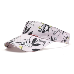 Close-up of pink botanical print sun hat showing floral patterns and reinforced stitching
