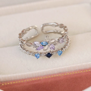 Detail view of double-layer silver ring with purple and blue marquise-cut zircons