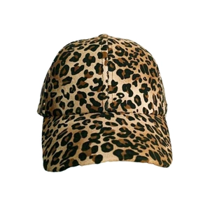 Detail shot of leopard print twill fabric and curved brim on a stylish baseball cap