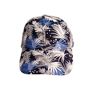 Detail of blue tropical palm leaf print on breathable six-panel structured baseball cap