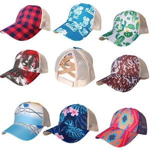 Detail of assorted tie-dye trucker hats with breathable mesh and ponytail friendly back design