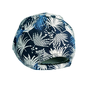 Back view of navy baseball cap with leaf prints and adjustable arch strap opening