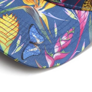 Blue baseball cap featuring floral and butterfly embroidery with high-quality stitching