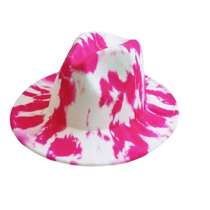 Detailed close-up showing the pink tie-dye pattern on the white felt fedora hat