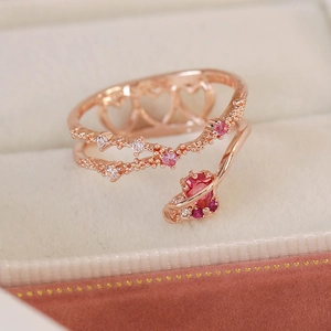 Detail of rose gold adjustable double layer ring with micro-set heart stones and zircons