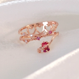 Close-up of rose gold double-layer open ring with pink heart zircon and pave settings