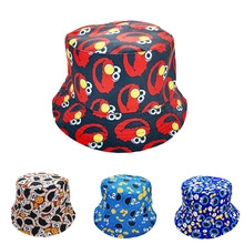 Close-up of printed cotton bucket hats featuring colorful cartoon character patterns