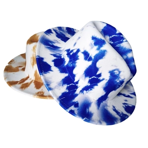 Detailed view of tie-dye fedora felt hats in blue and brown stylish color block patterns