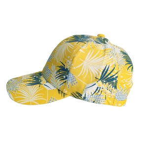 Detailed view of yellow baseball cap featuring tropical palm leaf print and curved brim