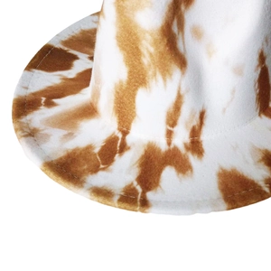 Close-up of brown and white cow print felt hat showing premium stitching details