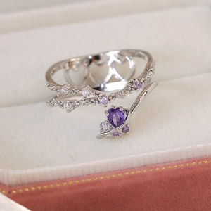 Detail of silver double-layer ring with purple heart zircon and pave crystals