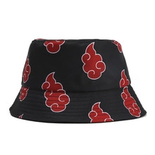 Detail of black outdoor bucket hat featuring red cloud pattern on durable canvas fabric