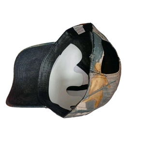 Internal view of bionic camo baseball cap featuring black sweatband and reinforced lining