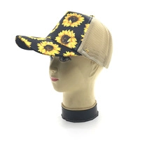 Detail of sunflower print baseball cap with beige breathable mesh and curved brim