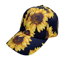Close-up detail of sunflower embroidery on black breathable cotton baseball cap for women