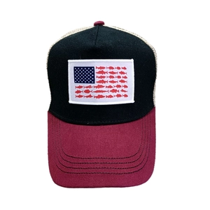 Detail showing creative fish silhouette American flag patch on a mesh trucker hat