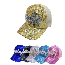 Close-up of children's sequin baseball caps with Baby letter patch in six various colors
