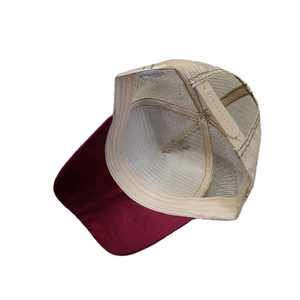 Classic maroon and beige mesh trucker hat with adjustable snapback for outdoors