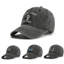 Detailed views of gray washed cotton baseball caps with various embroidered patterns and designs