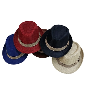 Detail view of five assorted woven fedora hats for children with striped decorative bands