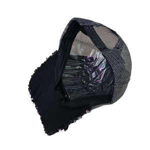 Detail view of the breathable mesh back and adjustable strap on a sequin baseball cap