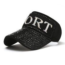 Detail of black breathable fabric sun visor with sparkling rhinestones and SPORT logo