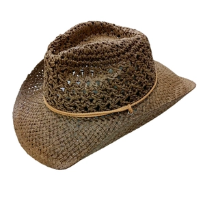 Close-up of brown straw fedora with fine weaving craftsmanship and decorative rope band