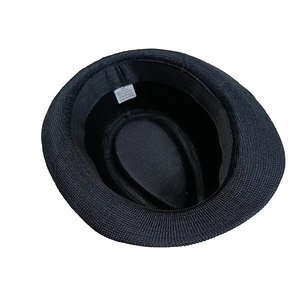 Detail of child fedora hat inner lining with material label and size 54 tag