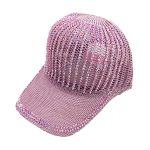 Detail of pink knitted baseball cap with breathable hollow mesh and iridescent rhinestones