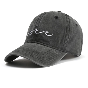 Detail of grey washed cotton baseball cap featuring white wave embroidery on front